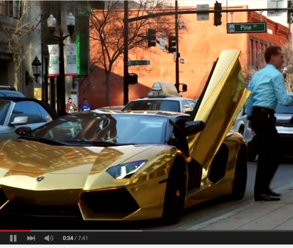 Daniel Fernandes Rojo Filho exits a gold Lamborghini in the area of Pine Street in Orlando, Fla. Source: DFRF promo on YouTube, c. April 2015.